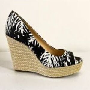 Vince Camuto, peep toe, slip-on, jute-wrapped wedge heels.